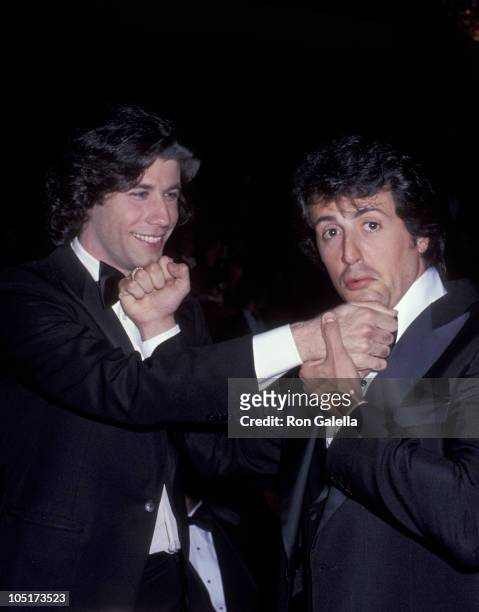 John Travolta and Sylvester Stallone during 50th Annual Academy Awards at Dorothy Chandler Pavillion in Los Angeles, California, United States.