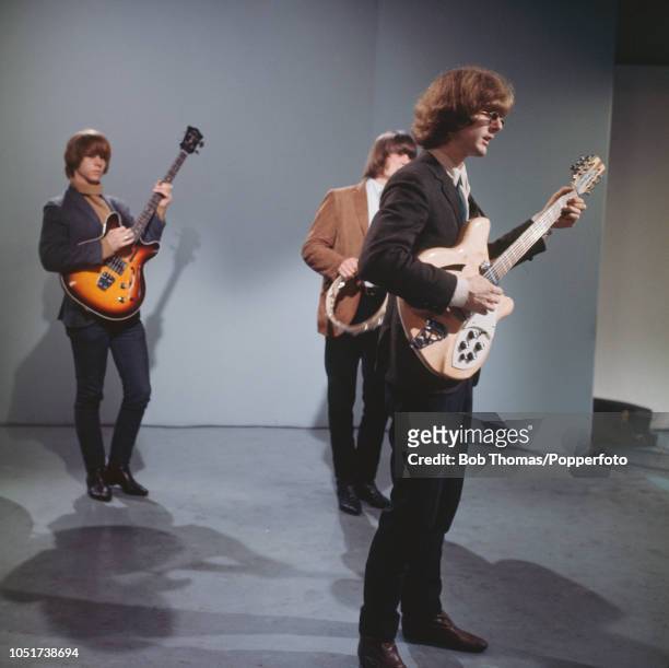 American rock band The Byrds in concert, August 1965. From left to right, Chris Hillman, Gene Clark and Jim McGuinn.