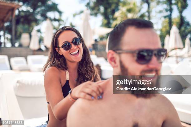 couple enjoying the beach massage - massage funny stock pictures, royalty-free photos & images