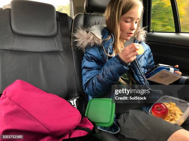 after school  snack - eating in car stock pictures, royalty-free photos & images