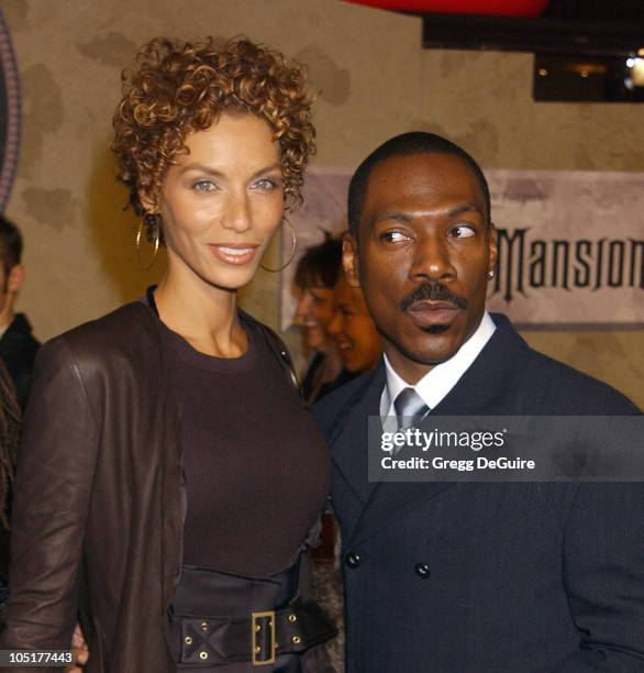 Nicole Murphy and Eddie Murphy during "The Haunted Mansion" World Premiere at El Capitan Theatre in Hollywood, California, United States.