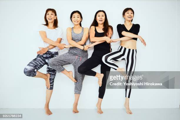 yoga leader & women in cool pose - japanese old woman stock pictures, royalty-free photos & images