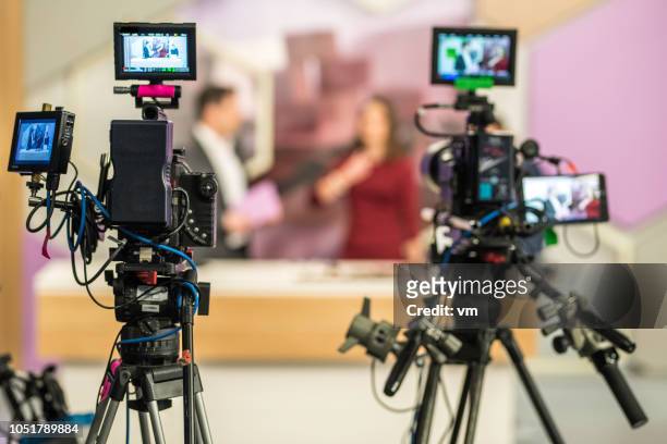 two cameras filming a tv-show - anúncio de televisão imagens e fotografias de stock