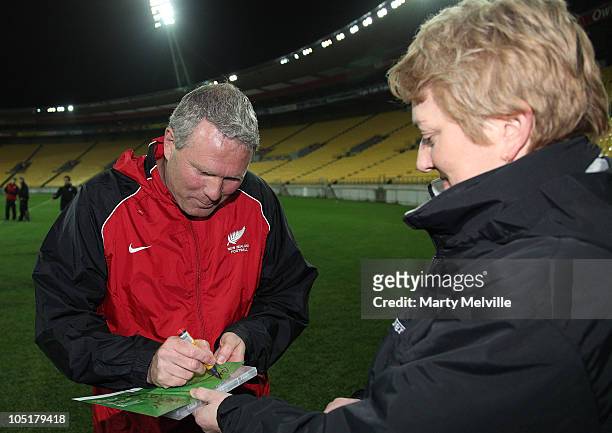 Head coach of the All Whites Ricki Herbert signs autographs during a New Zealand All Whites training session at the Westpac Stadium on October 11,...