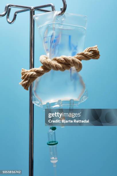 intravenous therapy choked by rope - bjarte rettedal stock pictures, royalty-free photos & images