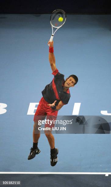 Novak Djokovic of Serbia serves against David Ferrer of Spain during their men's singles final at the National Tennis Center in Beijing on October...