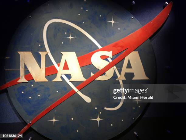 An old NASA logo hangs on a wall at the Heroes & Legends exhibit at Kennedy Space Center Visitor Complex in November 2016. The NASA Office of the...