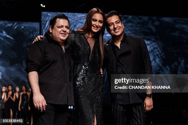 Bollywood actress Sonakshi Sinha presents creations by Indian designer Rohit Gandhi and Rahul Khanna during the Lotus Make-UP India Fashion Week...