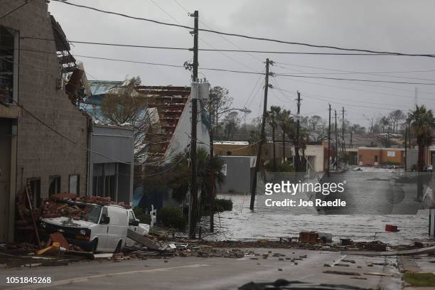 Damaged buildings and a flooded street are seen after hurricane Michael passed through the downtown area on October 10, 2018 in Panama City, Florida....