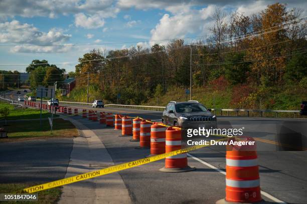 Traffic passes by the site of a fatal limousine crash that killed 20 people near the intersection of Route 30 South and Route 30A, October 10, 2018...