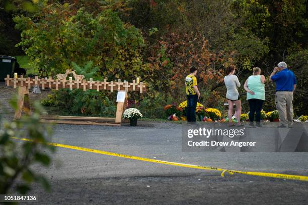 Mourners visit the site of a fatal limousine crash that killed 20 people near the intersection of Route 30 South and Route 30A, October 10, 2018 in...