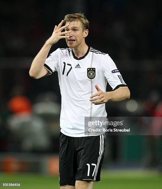 Per Mertesacker of Germany gestures during the EURO 2012 Group A qualifier match between Germany and Turkey at Olympia Stadium on October 8, 2010 in...