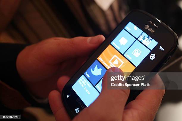 Person holds a new Windows Phone 7 mobile operating system on October 11, 2010 in New York, New York. The phone, which will be available in the...