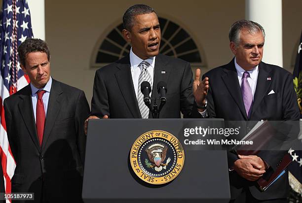 Treasury Secretary Timothy Geithner and Transportation Secretary Ray LaHood listen as U.S. President Barack Obama makes a statement in the Rose...