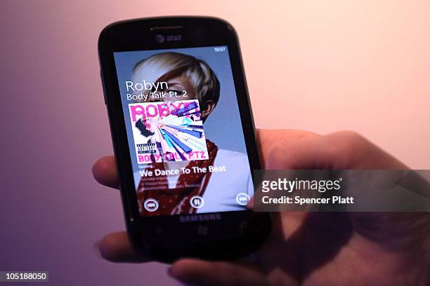 Person holds a new Windows Phone 7 mobile operating system on October 11, 2010 in New York, New York. The phone, which will be available in the...