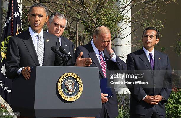 President Barack Obama speaks while flanked by Secretary of Transportation Ray LaHood, Governor Ed Rendell and Los Angelos Mayor Antonio...