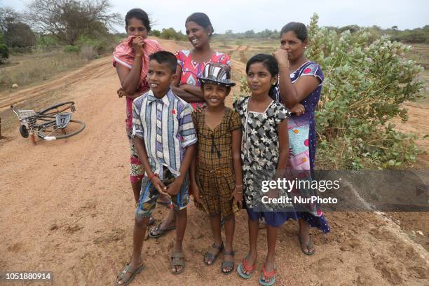 Sri Lankan widowed women whose husbands were members of the Tamil Tigers and were killed during the civil war pose for a photo along with their...