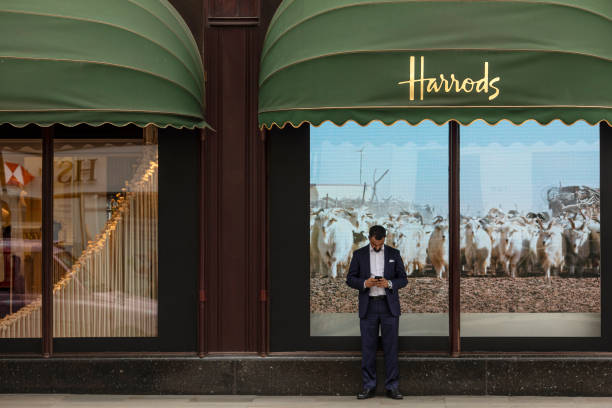 Man checks his phone outside the department store Harrods, near the home of Zamira Hajiyeva, the wife of Azerbaijan state banker Jahangir Hajiyev, on...