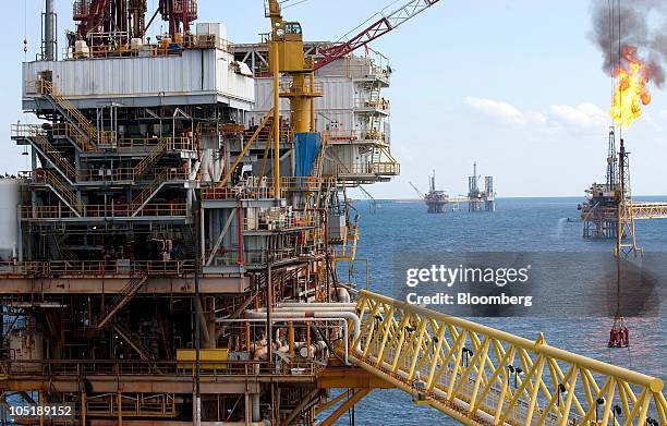 Group of workers are lowered into a ship by crane from the Tonal oil rig owned by Mexican oil company Pemex, located 65 miles northeast of Ciudad del...