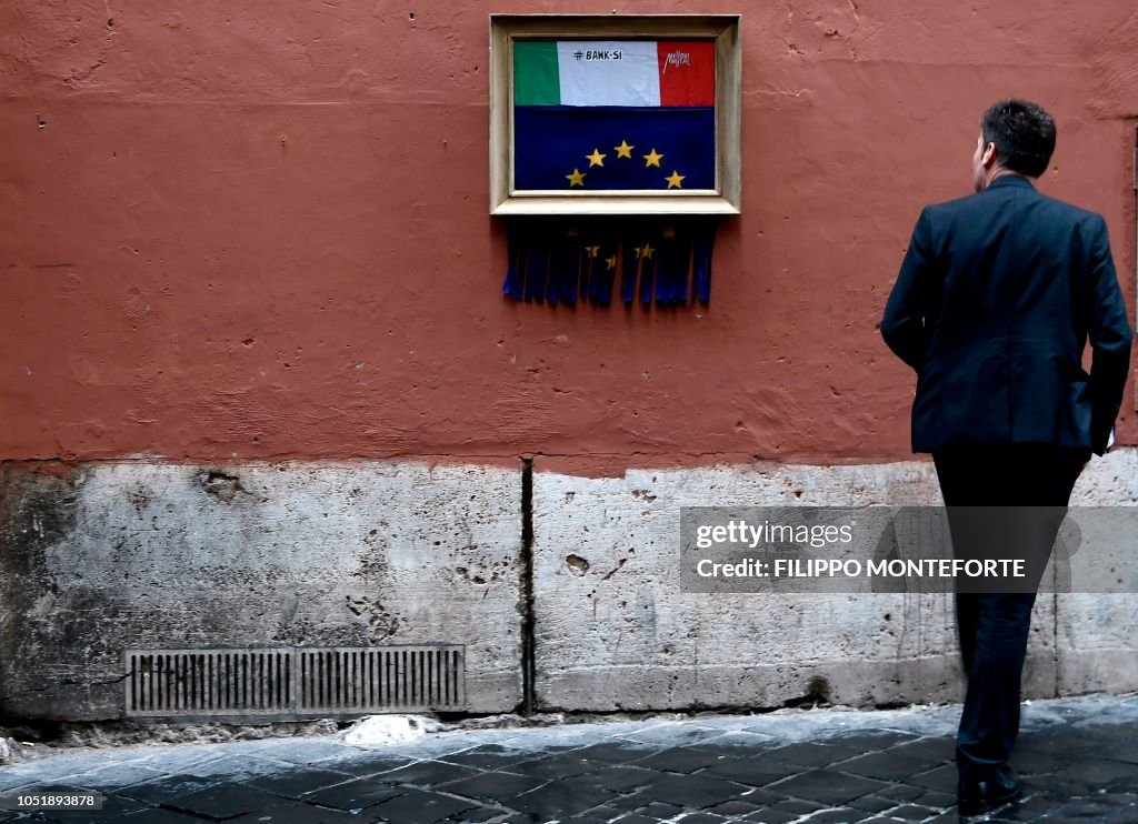 TOPSHOT-ITALY-EUROPE-ECONOMY-URBAN-STREET-ART