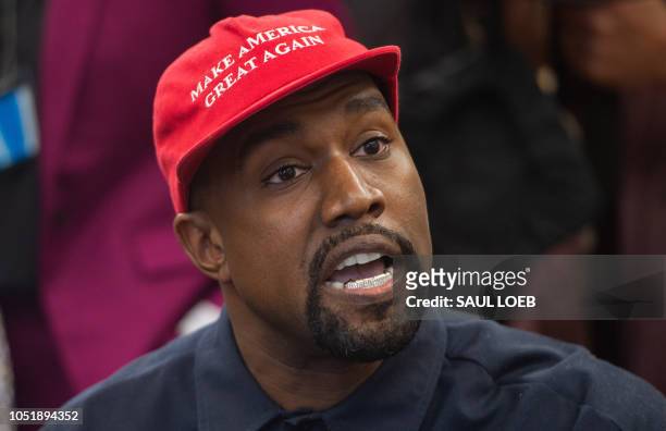 Rapper Kanye West speaks during his meeting with US President Donald Trump in the Oval Office of the White House in Washington, DC, on October 11,...