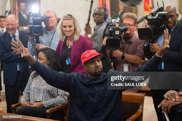 Rapper Kanye West speaks during his meeting with US President Donald Trump in the Oval Office of the White House in Washington, DC, on October 11,...