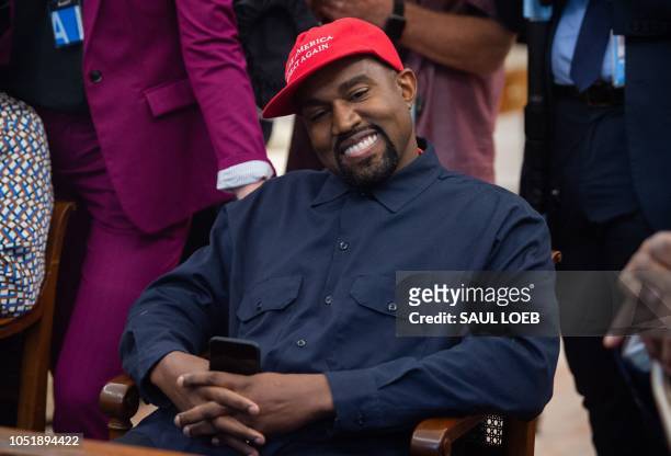 In this file photo rapper Kanye West speaks during his meeting with US President Donald Trump in the Oval Office of the White House in Washington,...