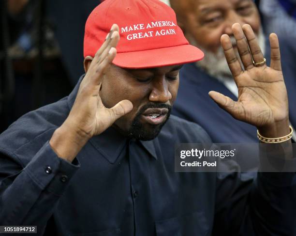 Rapper Kanye West speaks during a meeting with U.S. President Donald Trump in the Oval office of the White House on October 11, 2018 in Washington,...