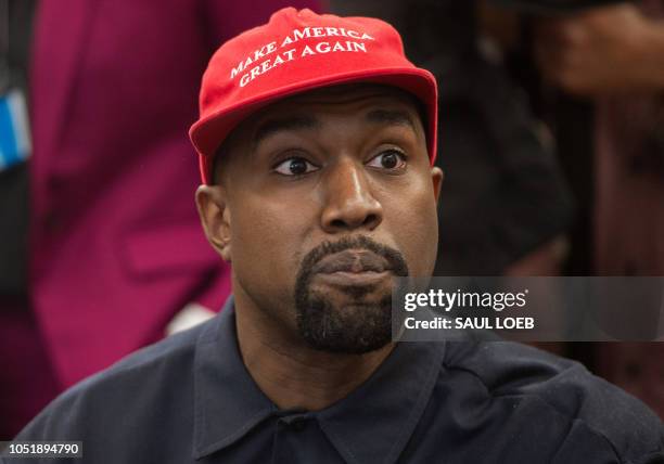 Rapper Kanye West speaks during his meeting with US President Donald Trump in the Oval Office of the White House in Washington, DC, on October 11,...