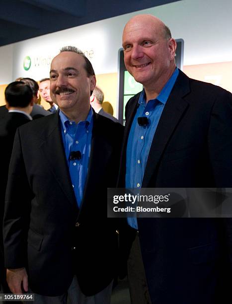 Ralph De La Vega, president and chief executive officer of AT&T's Inc.'s mobility and consumer markets division, left, and Steve Ballmer, chief...