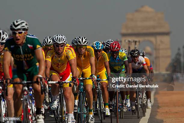The peloton tavels up Rajpath as they compete in the men's road race at India Gate during day seven of the Delhi 2010 Commonwealth Games on October...