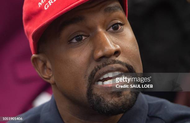 Kanye West meets with US President Donald Trump in the Oval Office of the White House in Washington, DC, October 11, 2018.