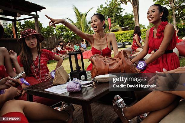 Wirittorn Narapaipimol points her finger at another contestant while relaxing in the garden of a restaurant May 13, 2009 in Pattaya, Thailand....
