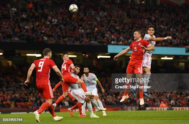 Marc Barta of Spain outjumps James Chester of Wales as he scores his team's fourth goal during the International Friendly match between Wales and...