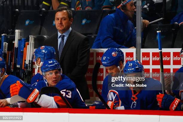 Assistant Coach John Gruden of the New York Islanders looks on from the bench against the San Jose Sharks at Barclays Center on October 8, 2018 the...