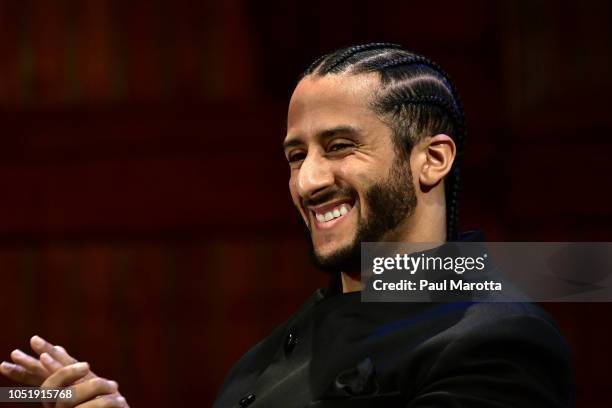 Colin Kaepernick on stage at the W.E.B. Du Bois Medal Award Ceremony at Harvard University on October 11, 2018 in Cambridge, Massachusetts. 2018...