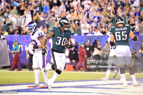 Corey Clement of the Philadelphia Eagles reacts after scoring a touchdown against the New York Giants during the first quarter at MetLife Stadium on...