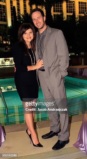 Actress Tiffani Thiessen and husband Brandy pose at the launch of PetitNest at at The Palazzo on October 10, 2010 in Las Vegas, Nevada.