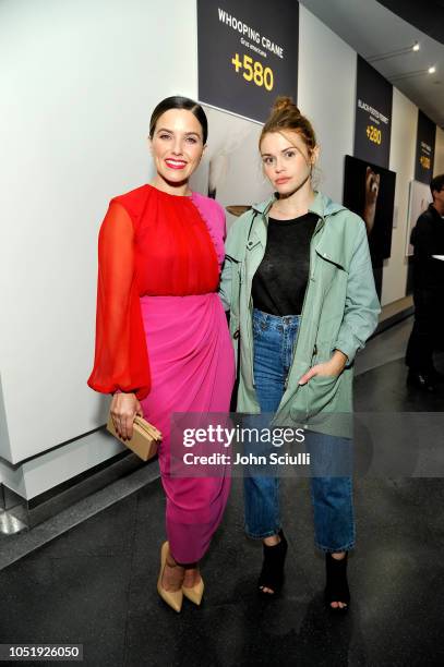 Sophia Bush and Holland Roden attend the National Geographic Photo Ark at Annenberg Space For Photography on October 11, 2018 in Century City,...
