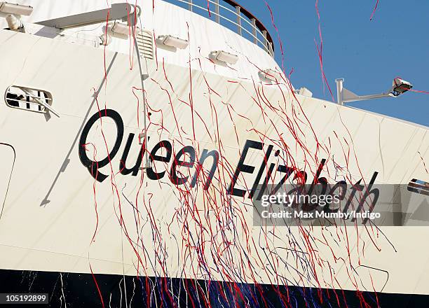 Streamers drop over the bow of the new Cunard cruise liner 'Queen Elizabeth' during the official naming by Queen Elizabeth II at Southampton Docks on...