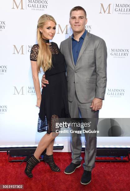 Paris Hilton and Chris Zylka attend the ViP Opening of Maddox Gallery Exhibition "Best Of British" at Maddox Gallery on October 11, 2018 in Los...