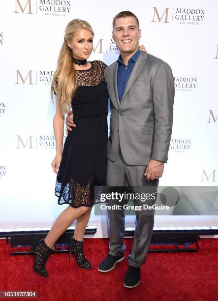 Paris Hilton and Chris Zylka attend the ViP Opening of Maddox Gallery Exhibition "Best Of British" at Maddox Gallery on October 11, 2018 in Los...