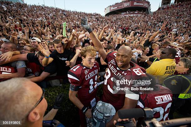 South Carolina Seth Strickland and Cliff Matthews victorious on field with fans after winning game vs Alabama. Columbia, SC 10/9/2010 CREDIT: Bob...