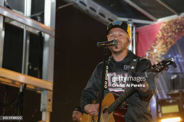 Chris Lucas and LoCash perform in the rain in the Pepsi Tailgate Tour before the Philadelphia Eagles vs New York Giants game at MetLife Stadium on...