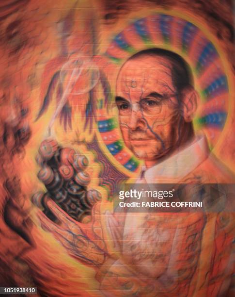 Portrait of late Swiss chemist Albert Hoffman Packages is seen on a collection of LSD blotting paper shown during an exhibition entitled "LSD, the 75...