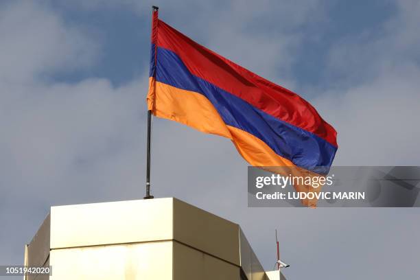 The Armenian national flag flies in the wind in Yerevan on October 11, 2018.