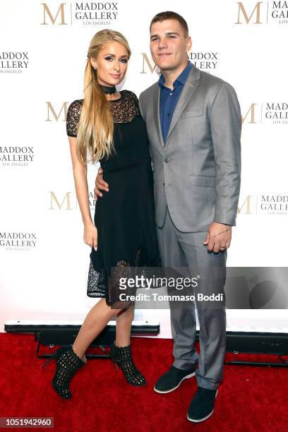 Paris Hilton and Chris Zylka attend the Grand Opening Maddox Gallery Los Angeles on October 11, 2018 in West Hollywood, California.