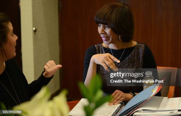 Baltimore mayor Catherine Pugh attends a with her director of special projects, Alexandra Smith, left, inside her office at City Hall in Baltimore,...