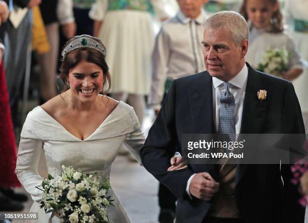 Princess Eugenie walks down the aisle with her father, Prince Andrew, the Duke of York, for her wedding to Jack Brooksbank at St George's Chapel in...