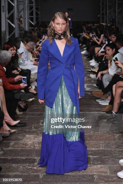 Model walks the runway during the Jesus de la Garsa - Mexico Disena by Elle fashion show at Mercedes Benz Fashion Week Mexico 2018 at Antiguo Colegio...